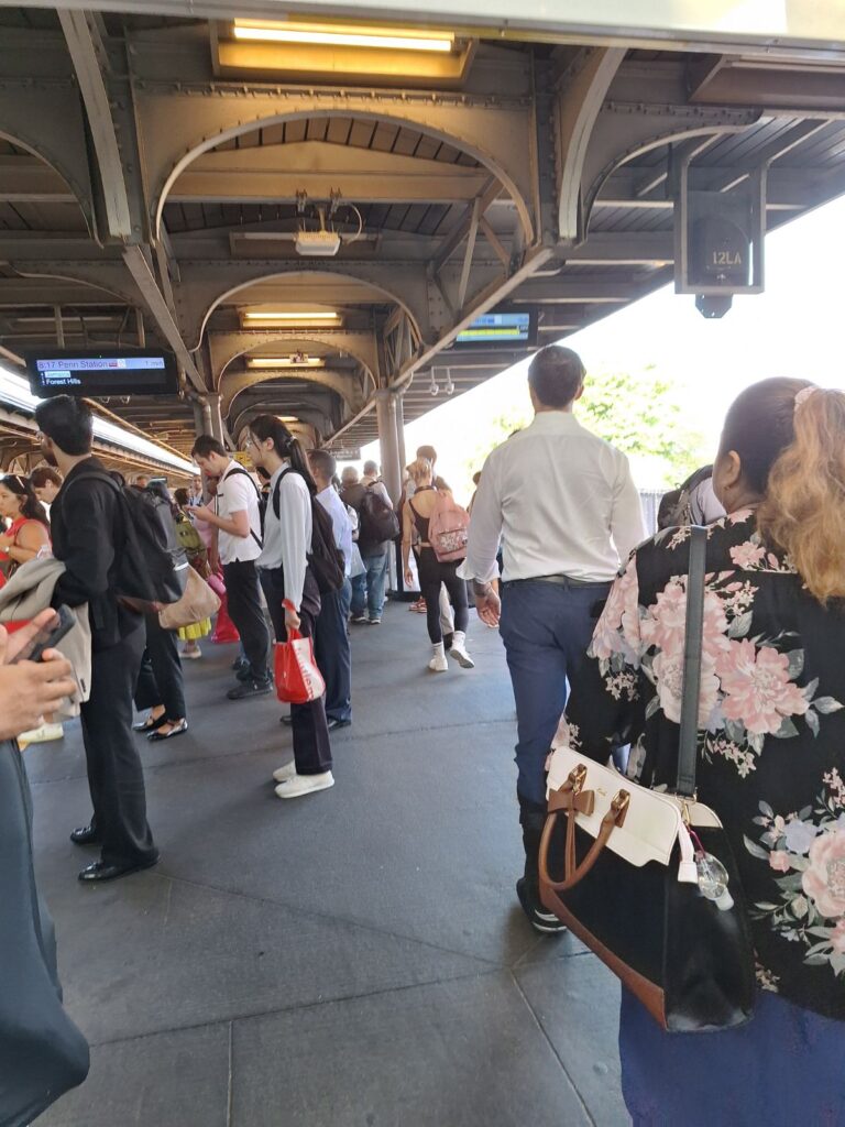 Inside Jamaica Station LIRR with passengers walking through platforms in New York City