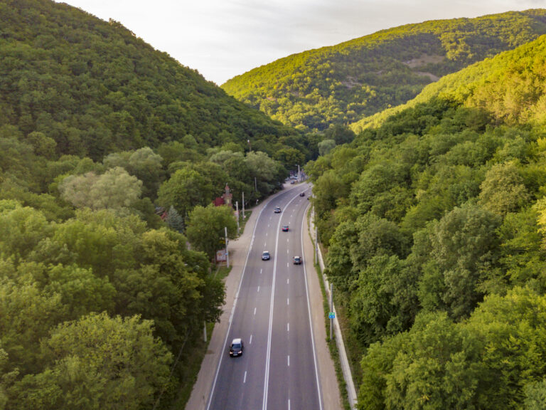 aerial view of wide highway between the mountains 2026 03 17 20 18 56 utc